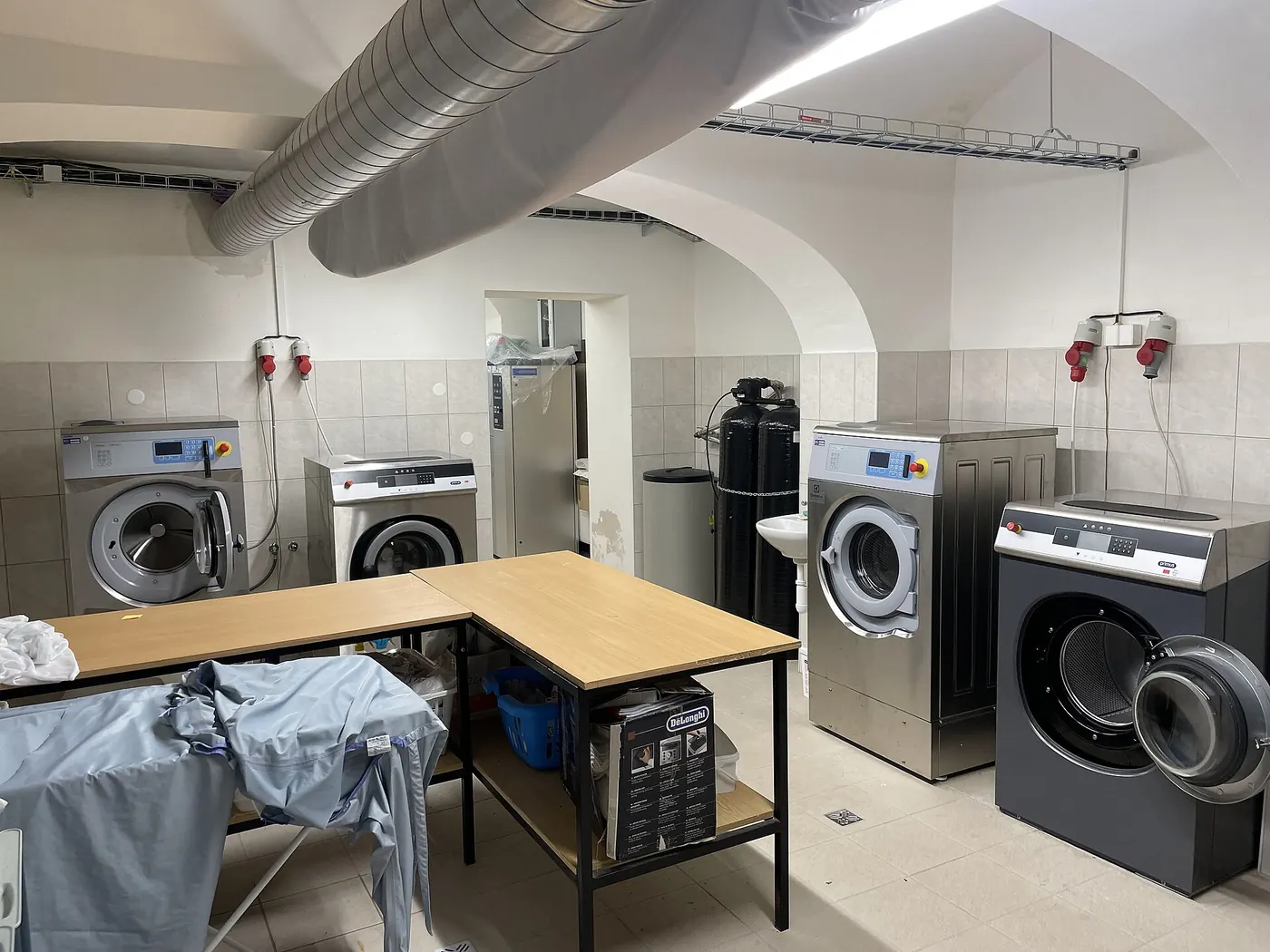 Row of industrial washing machines