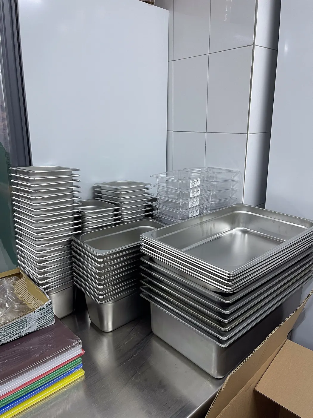 Stacked gastronorm containers in a commercial kitchen