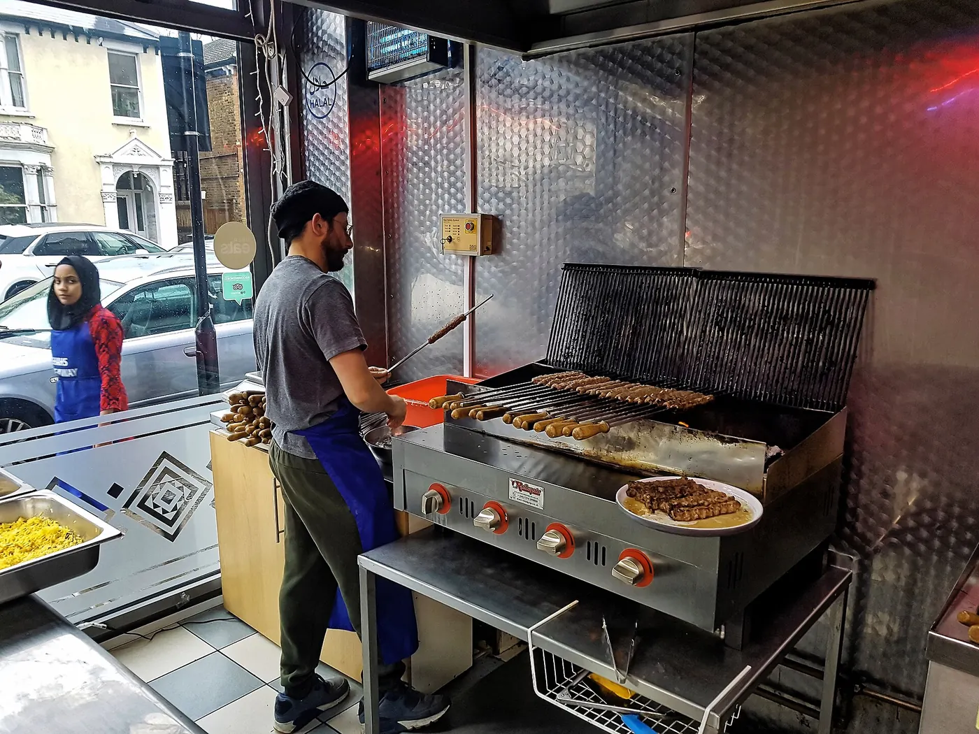 Commercial kitchen brigade preparing service in a stainless-steel restaurant kitchen